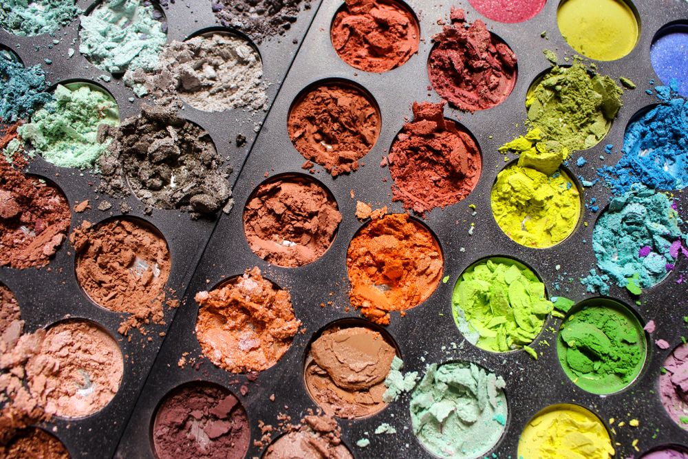 A colorful eyeshadow palette with an assortment of shades