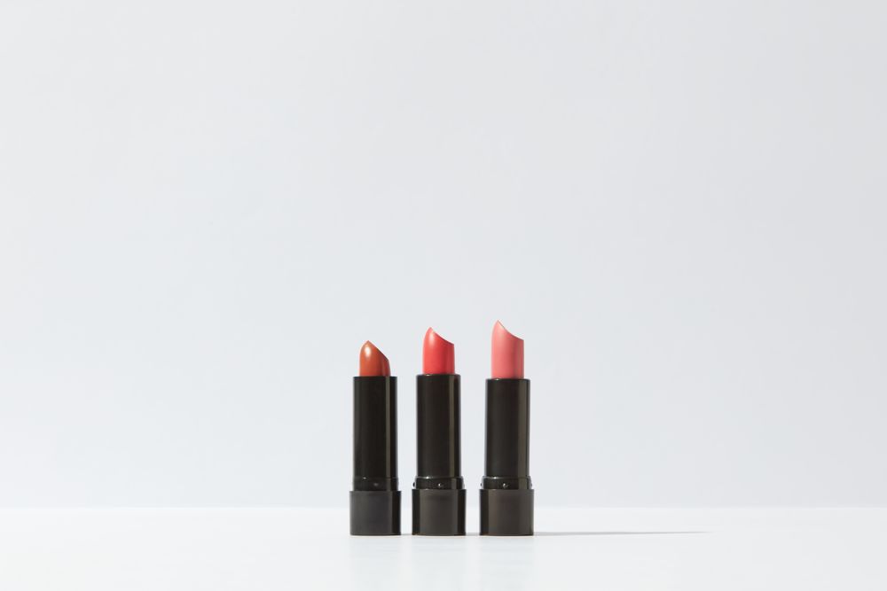 Three lipsticks displayed on a white background